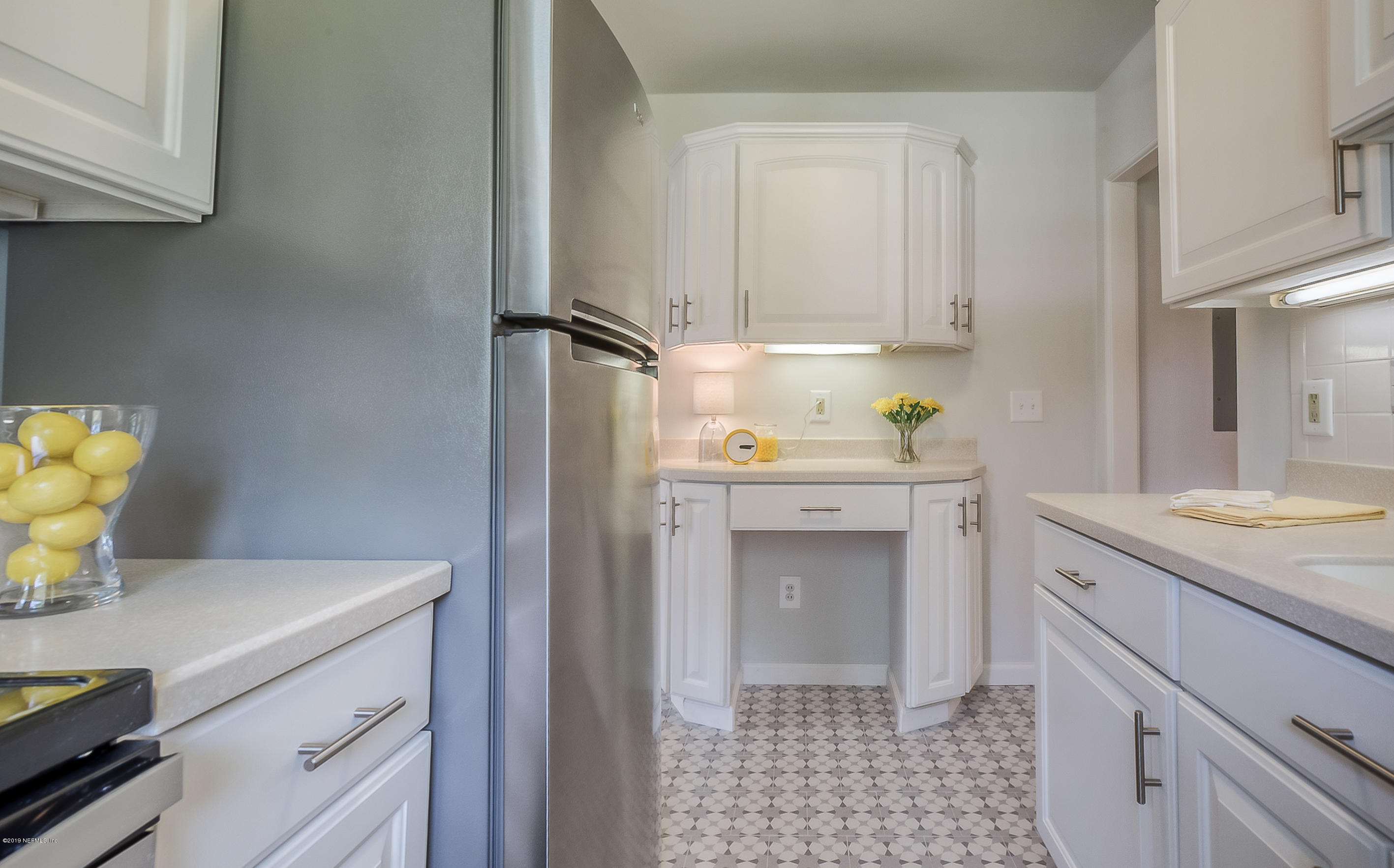4548 Milstead Road Jacksonville, FL 32210 - Photo 36 of 37 a kitchen with a sink cabinets and appliances