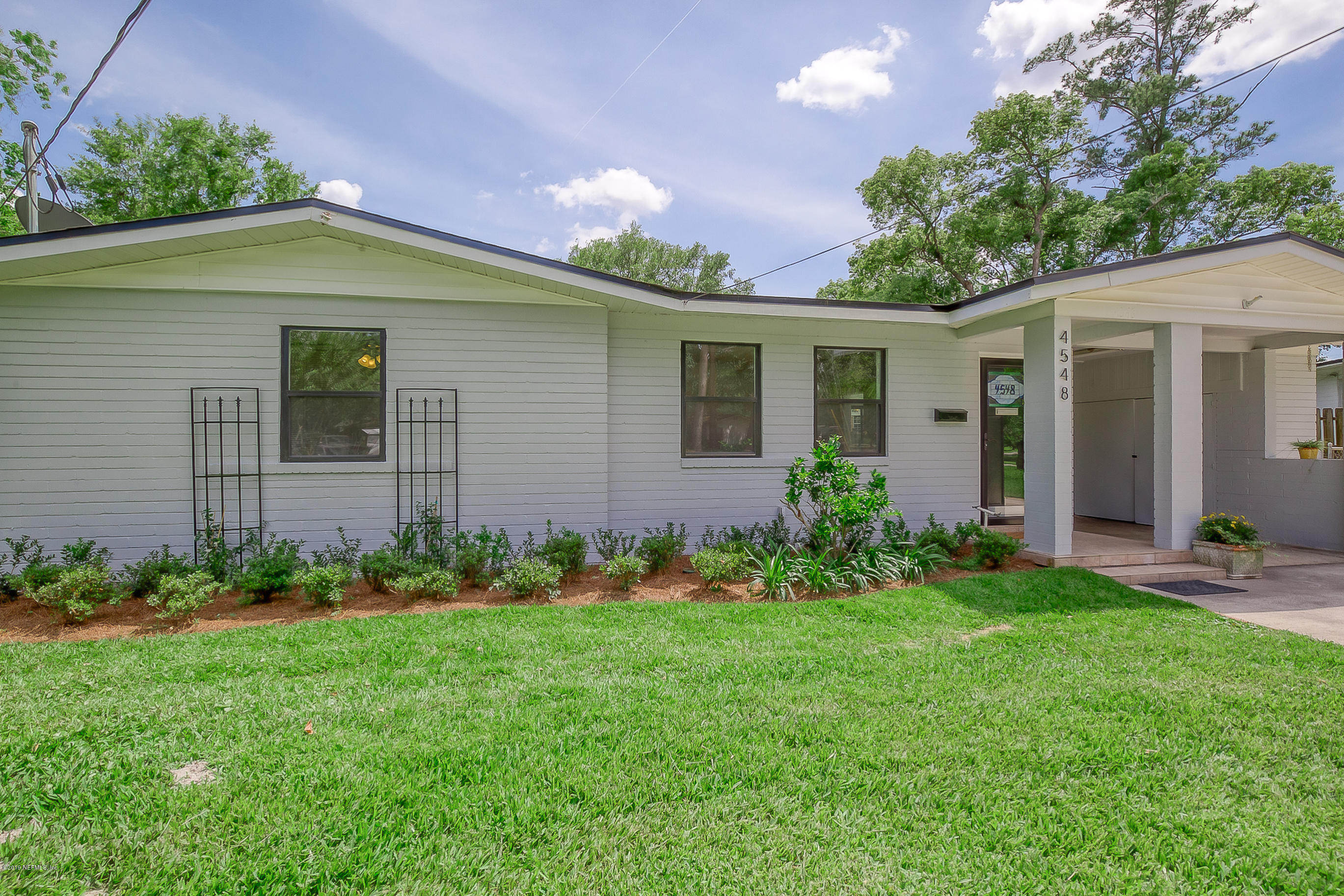 4548 Milstead Road Jacksonville, FL 32210 - Photo 4 of 37 a view of a house with garden