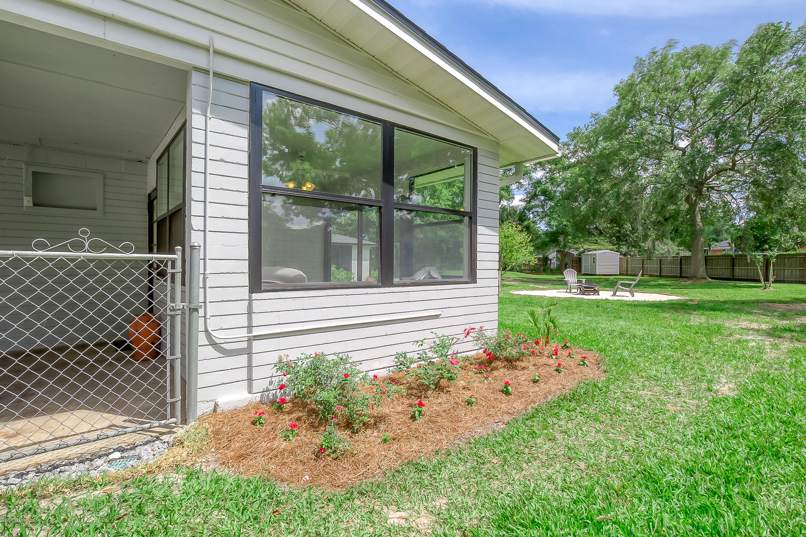 4548 Milstead Road Jacksonville, FL 32210 - Photo 6 of 37 a front view of a house with garden