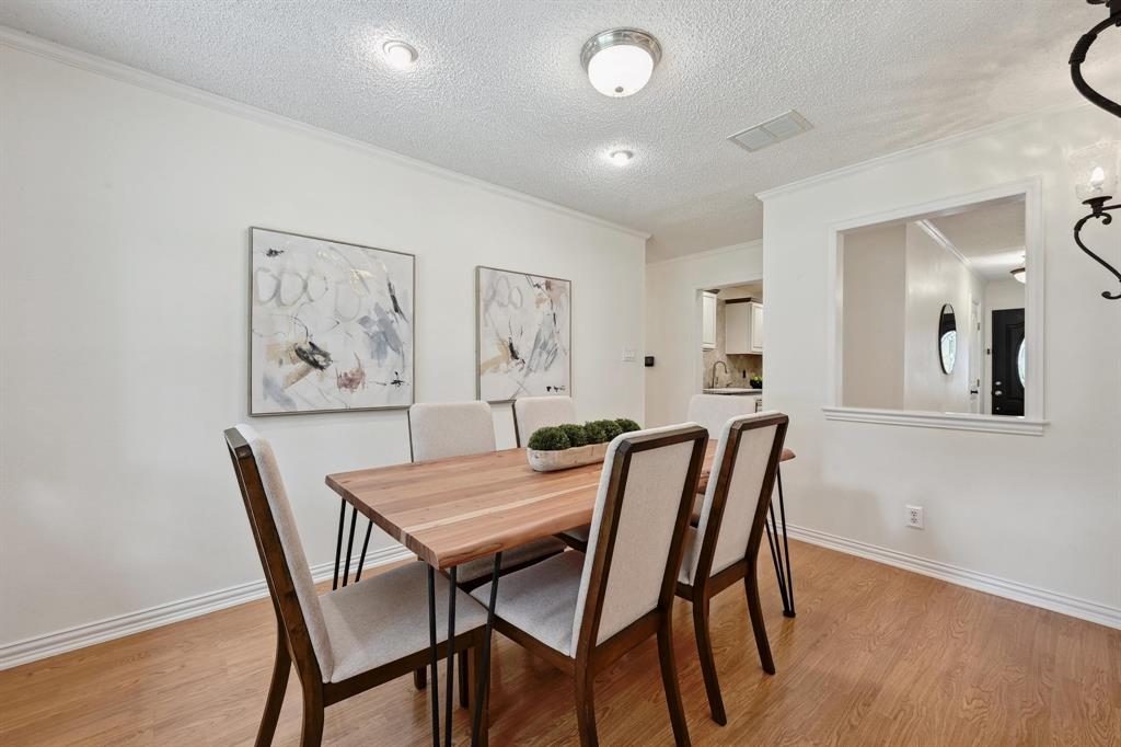 2406 Burly Oak Drive Austin, TX 78745 - Photo 12 of 21 a view of a dining room with furniture and wooden floor