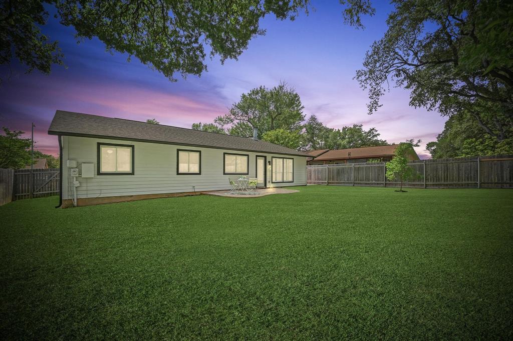2406 Burly Oak Drive Austin, TX 78745 - Photo 17 of 21 a front view of a house with garden