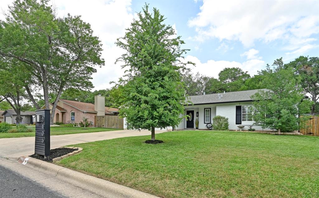 2406 Burly Oak Drive Austin, TX 78745 - Photo 19 of 21 a front view of house with yard and green space