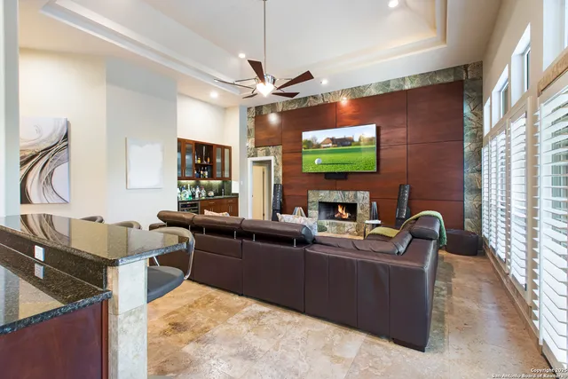 a kitchen with stainless steel appliances kitchen island granite countertop a sink and a granite counter tops