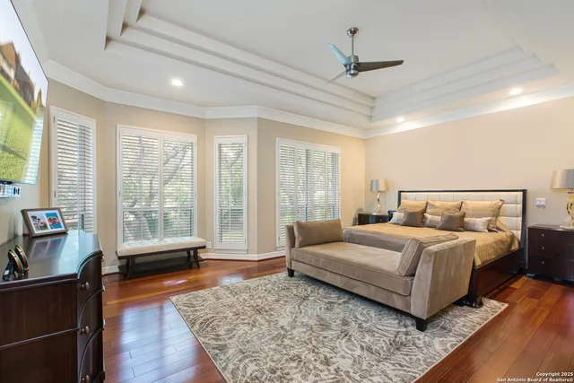 a spacious bedroom with a large bed and a couch