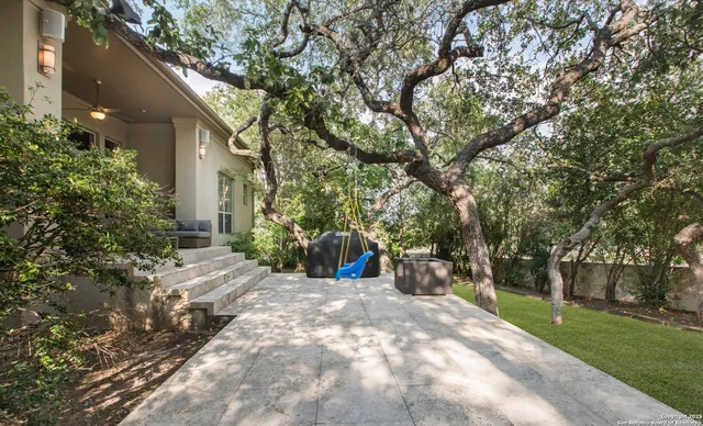 a view of a outdoor space with a patio and backyard