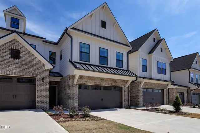 a front view of a house with yard