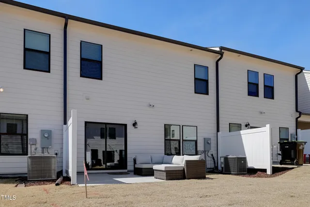 a couple of chairs in front of building