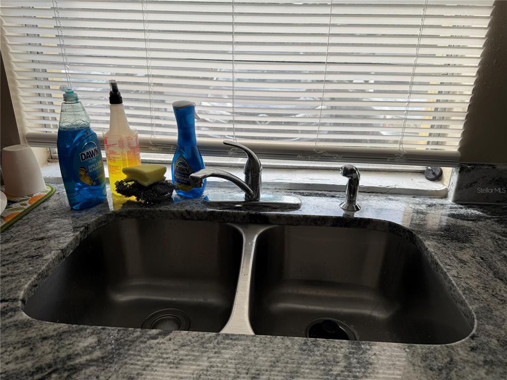 7605 Abonado Road, Unit 7605 Tampa, FL 33615 - Photo 5 of 13 a kitchen with a sink and a window