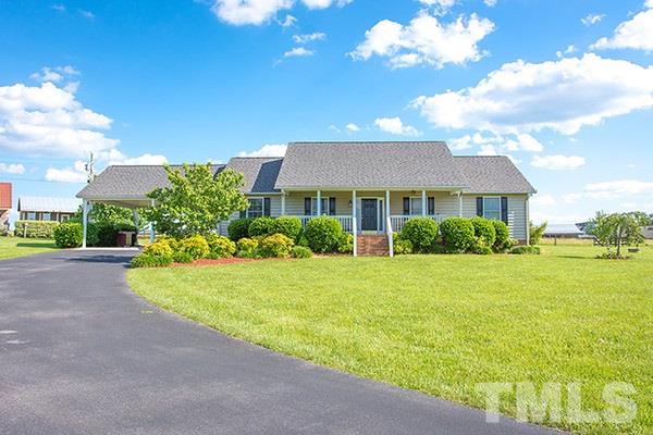 3540 Antioch Church Road Timberlake, NC 27583 - Photo 2 of 25 a front view of a house with garden