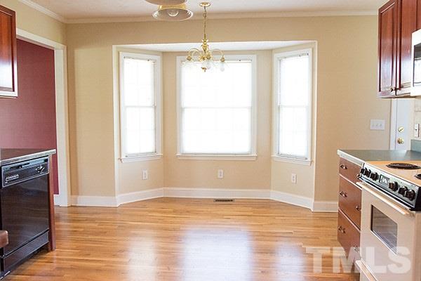 3540 Antioch Church Road Timberlake, NC 27583 - Photo 12 of 25 a view of an empty room with window and wooden floor