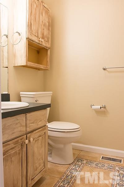 3540 Antioch Church Road Timberlake, NC 27583 - Photo 17 of 25 a bathroom with a toilet and a sink