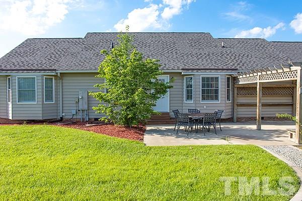 3540 Antioch Church Road Timberlake, NC 27583 - Photo 18 of 25 a view of house with backyard and sitting area