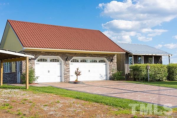 3540 Antioch Church Road Timberlake, NC 27583 - Photo 21 of 25 a front view of a house with garden