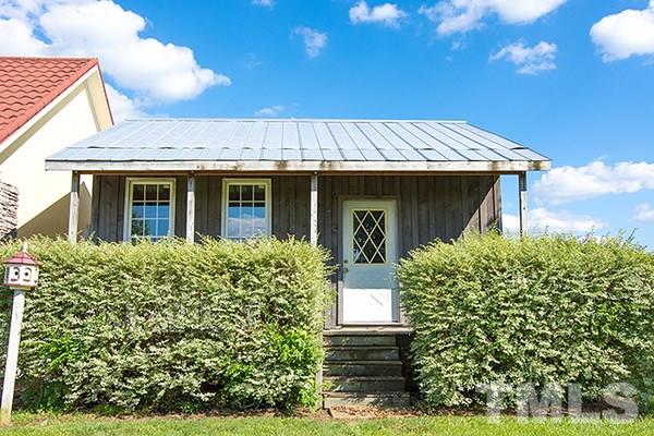 3540 Antioch Church Road Timberlake, NC 27583 - Photo 23 of 25 a front view of a house with garden
