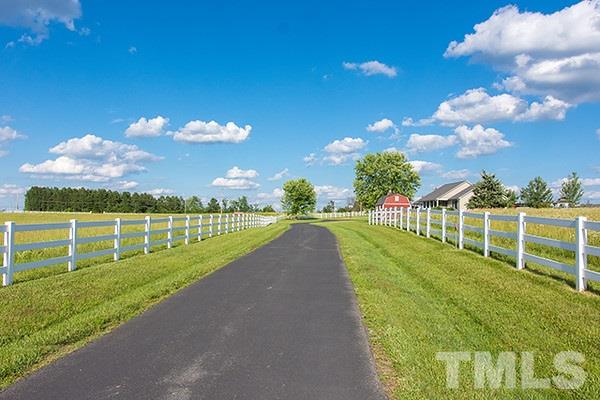 3540 Antioch Church Road Timberlake, NC 27583 - Photo 4 of 25 a view of a golf course with a swimming pool