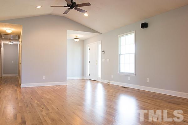 3540 Antioch Church Road Timberlake, NC 27583 - Photo 10 of 25 a view of an empty room with a window and wooden floor