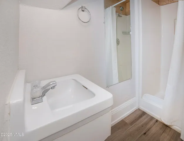 a bathroom with a bathtub and shower