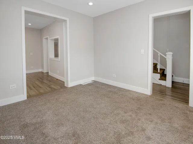 a view of a big room with closet and wooden floor