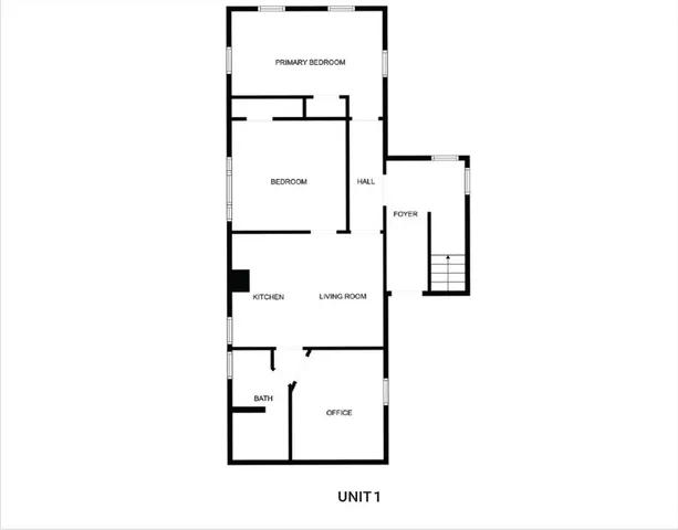 a picture of a bench in front of a wall