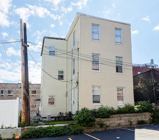 a front view of a house with trees