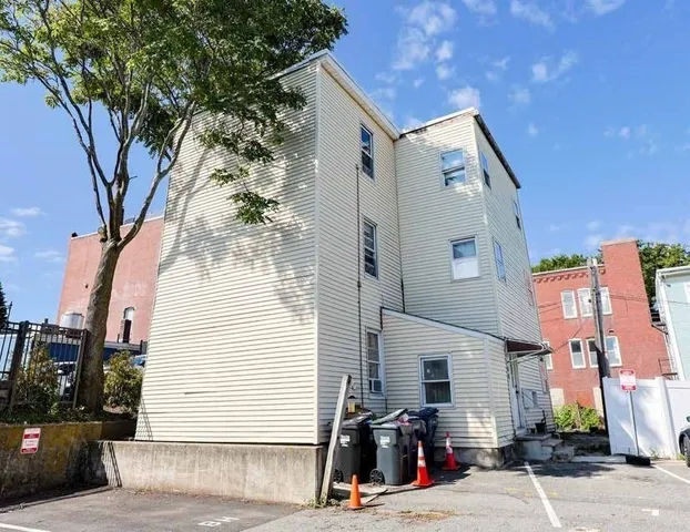 a view of a car parked in front of a house