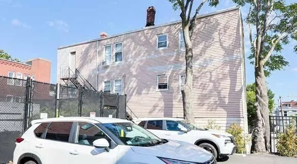 a view of a street with cars on road