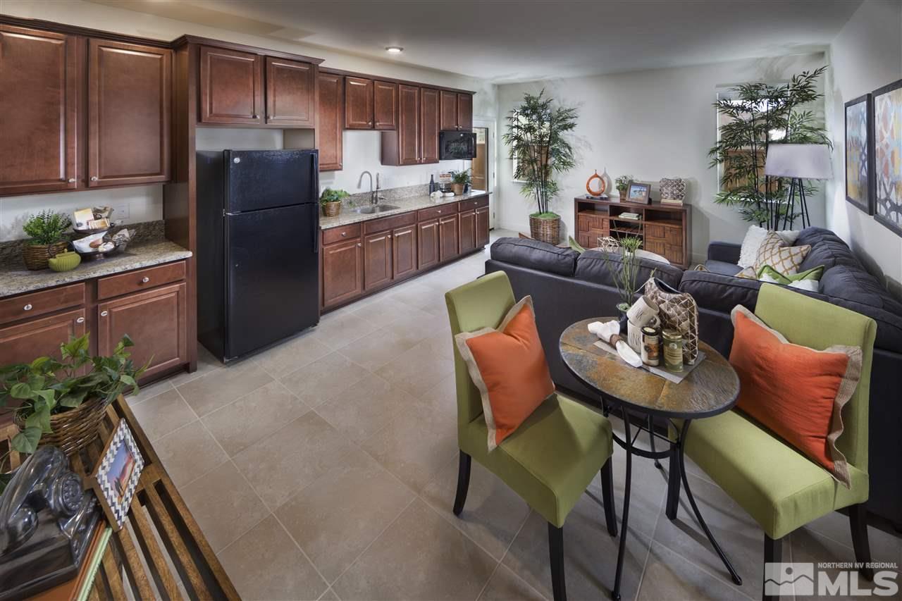10270 Rollins Drive Reno, NV 89521 - Photo 6 of 6 a living room with stainless steel appliances furniture a couch and a kitchen counter top