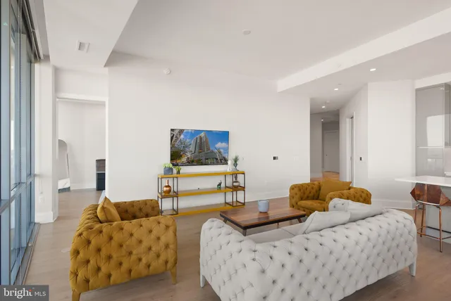 a kitchen with kitchen island granite countertop a sink stainless steel appliances and cabinets