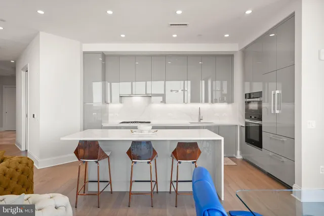 a bedroom with a bed and glass window