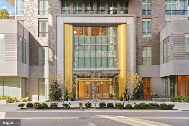a view of a brick building next to a road