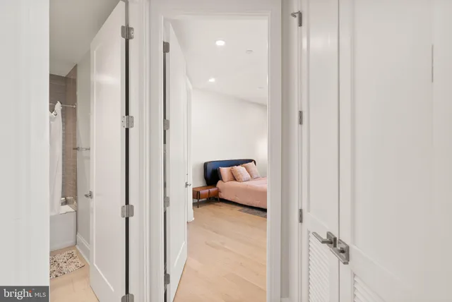 a view of a hallway with washer and dryer