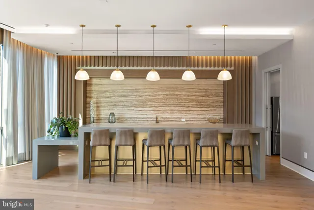 a view of swimming pool with outdoor seating