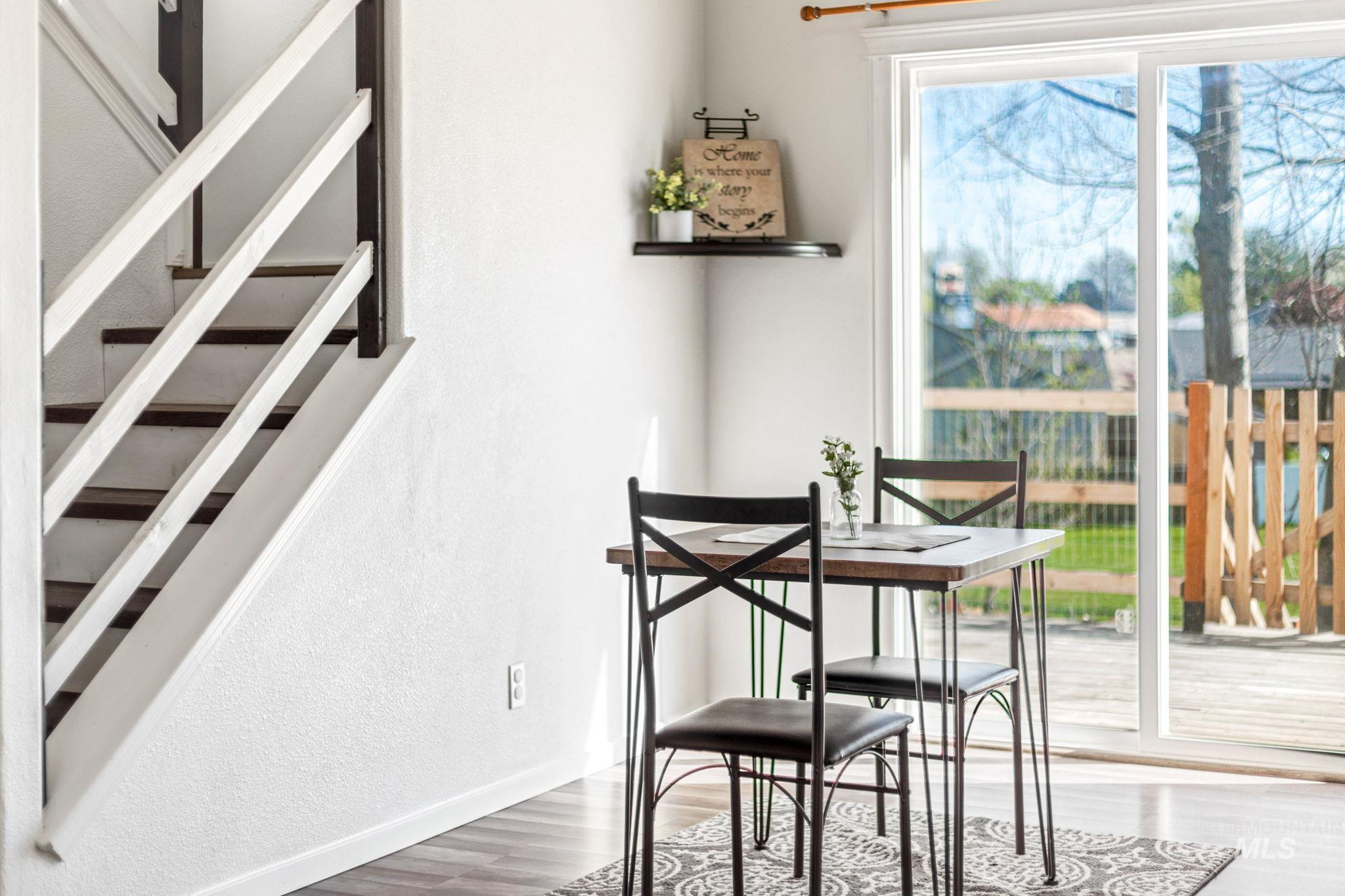 526 Cornwall Way Fruitland, ID 83619 - Photo 8 of 42 Dining space featuring a textured wall and wood finished floors