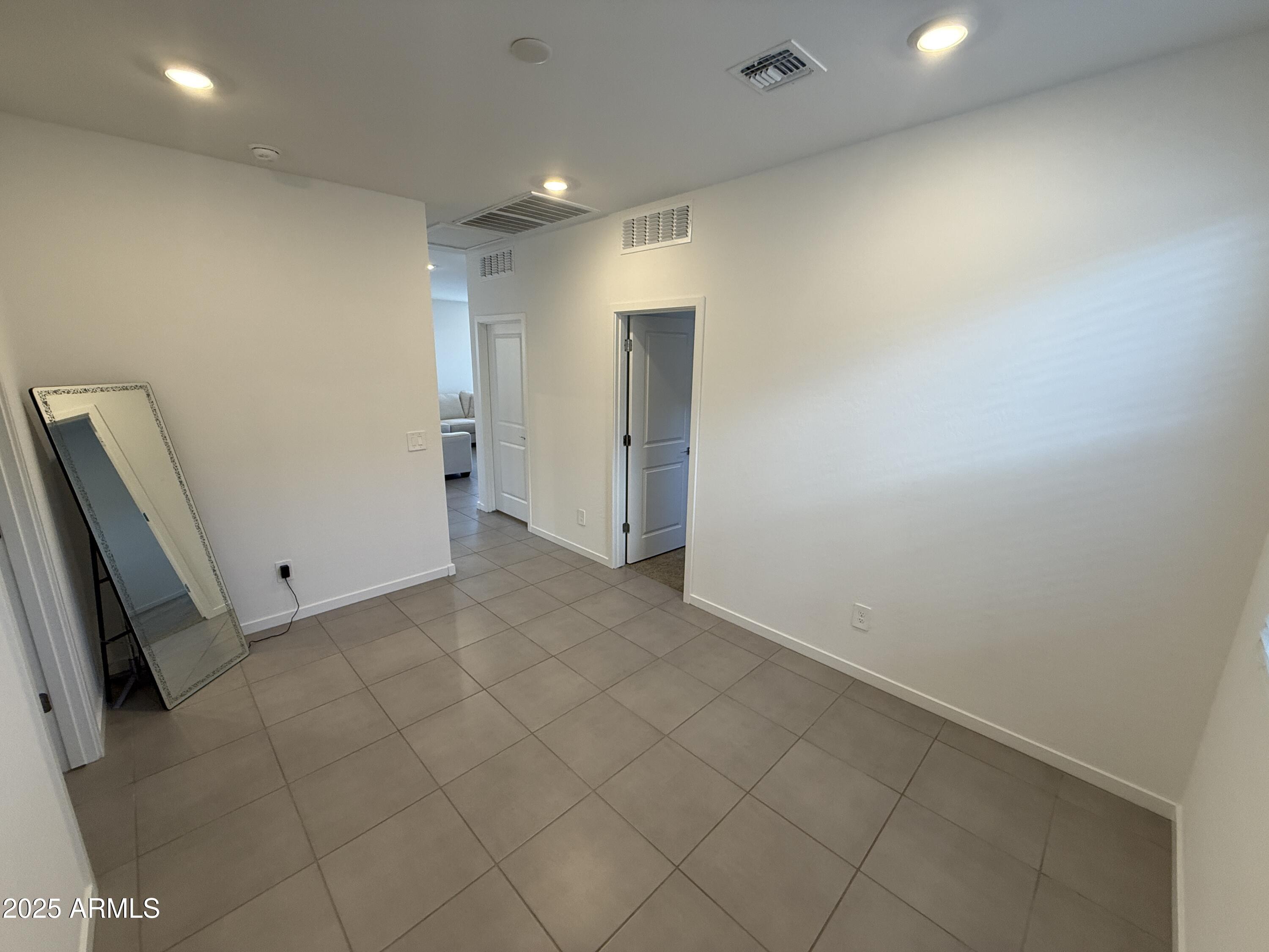 8534 West Warner Street Tolleson, AZ 85353 - Photo 20 of 36 an empty room with windows