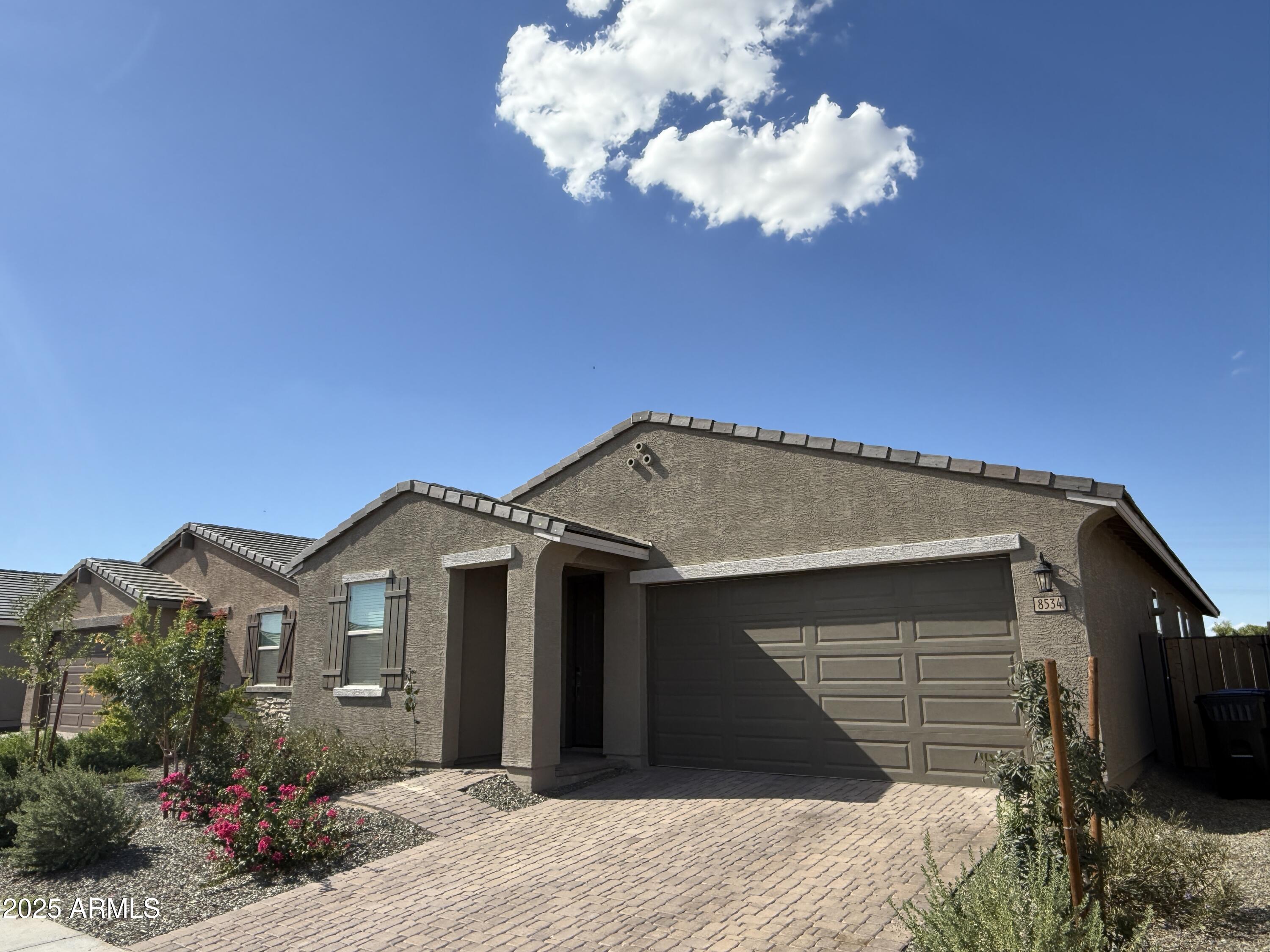 8534 West Warner Street Tolleson, AZ 85353 - Photo 2 of 36 a front view of a house