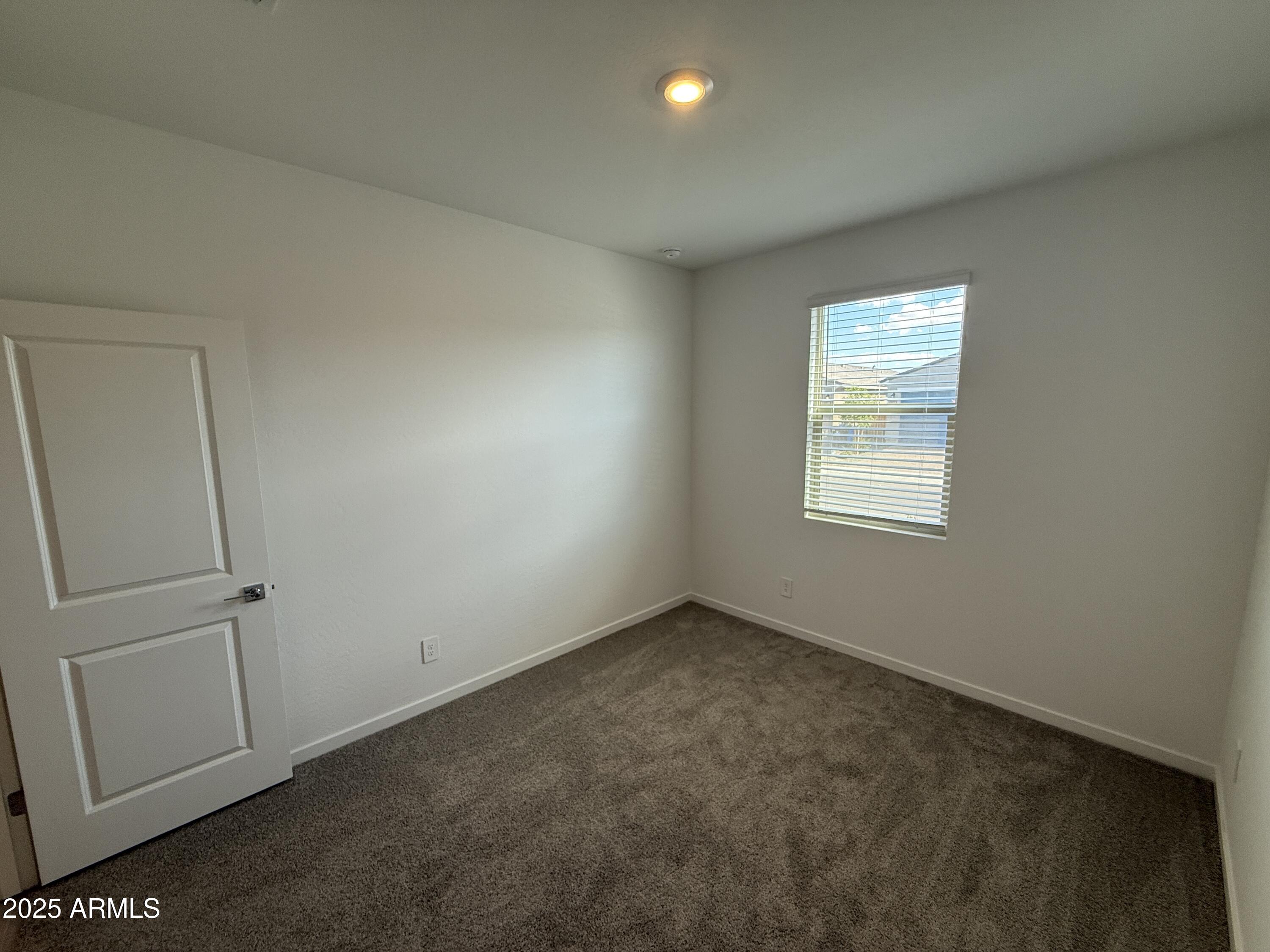 8534 West Warner Street Tolleson, AZ 85353 - Photo 25 of 36 a view of an empty room with a window