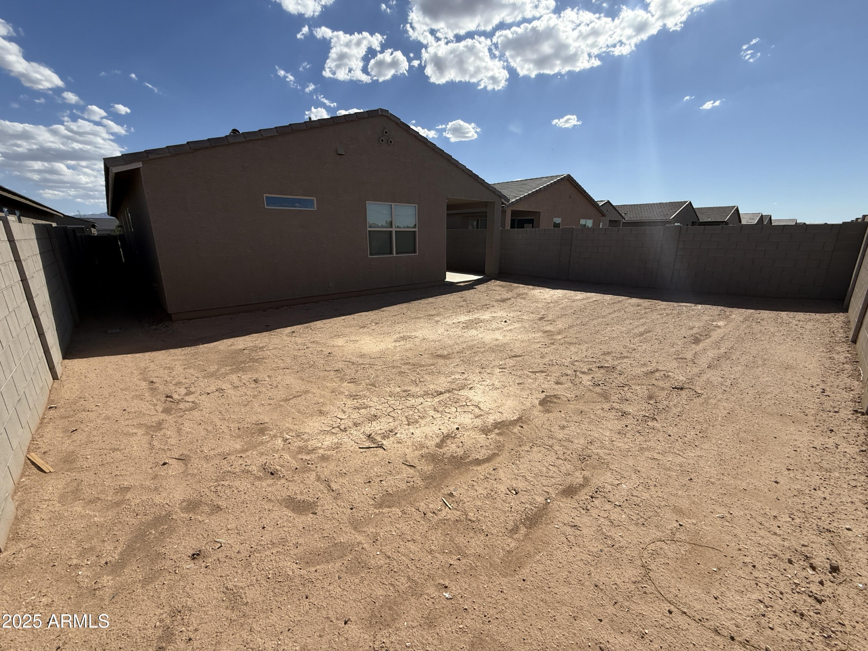 8534 West Warner Street Tolleson, AZ 85353 - Photo 35 of 36 a black and white building with trees in the background
