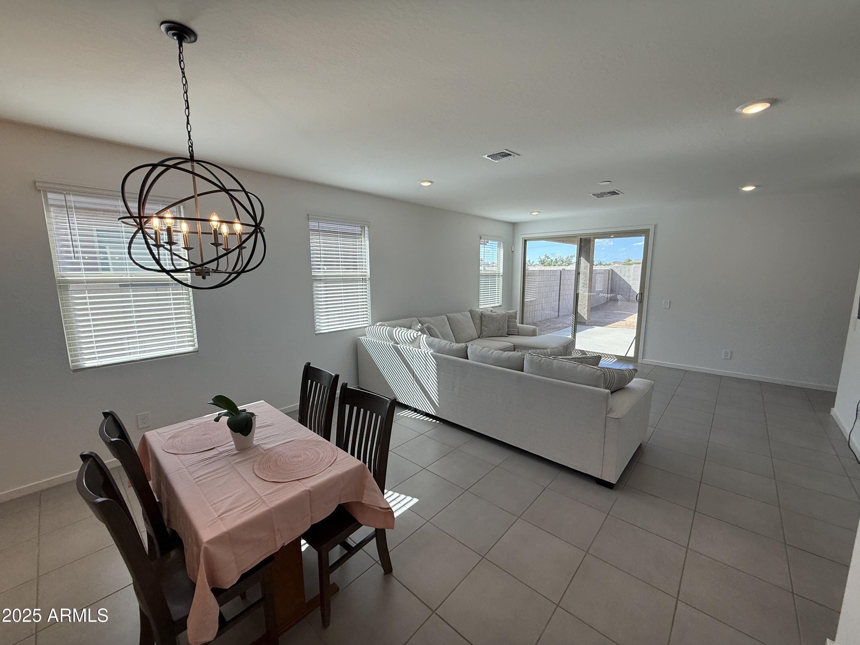 8534 West Warner Street Tolleson, AZ 85353 - Photo 8 of 36 a view of a dining room with furniture