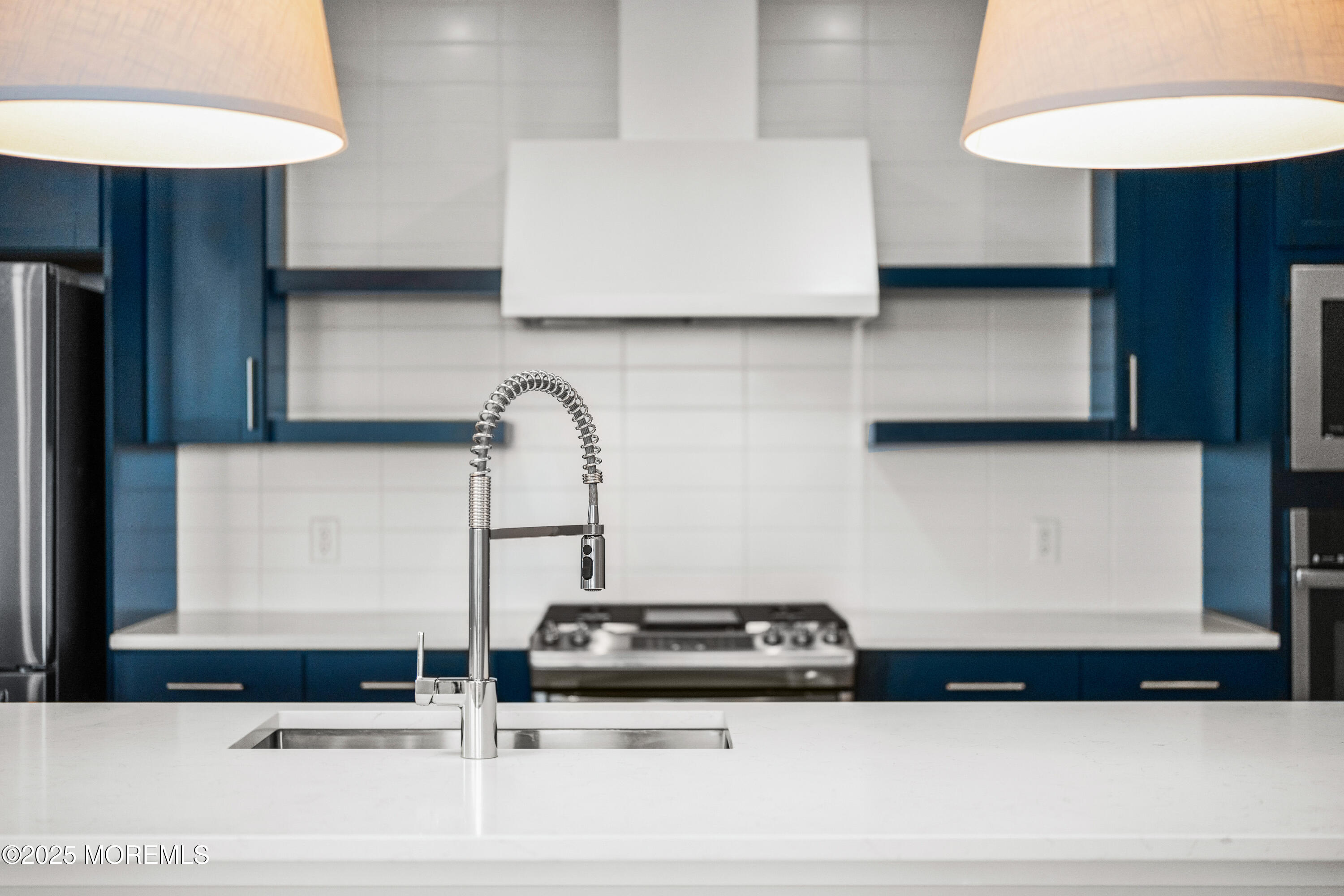 218 3rd Avenue, Unit 306 Asbury Park, NJ 07712 - Photo 14 of 66 a view of kitchen with stainless steel appliances granite countertop white cabinets and a stove