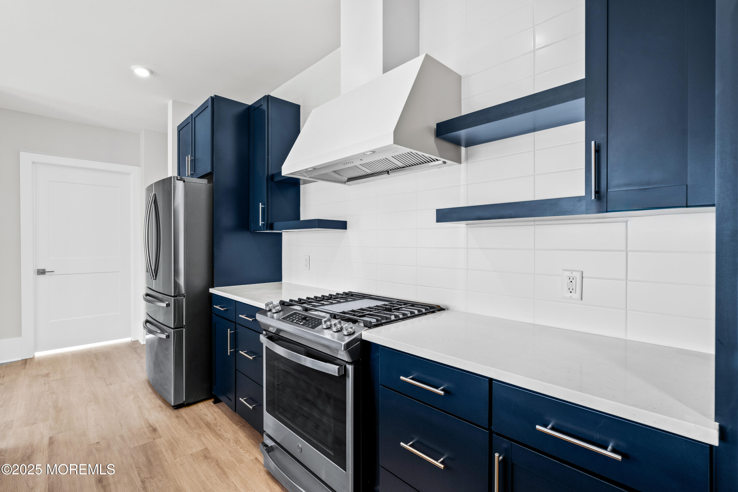 218 3rd Avenue, Unit 306 Asbury Park, NJ 07712 - Photo 16 of 66 a kitchen with stainless steel appliances granite countertop a sink stove and refrigerator