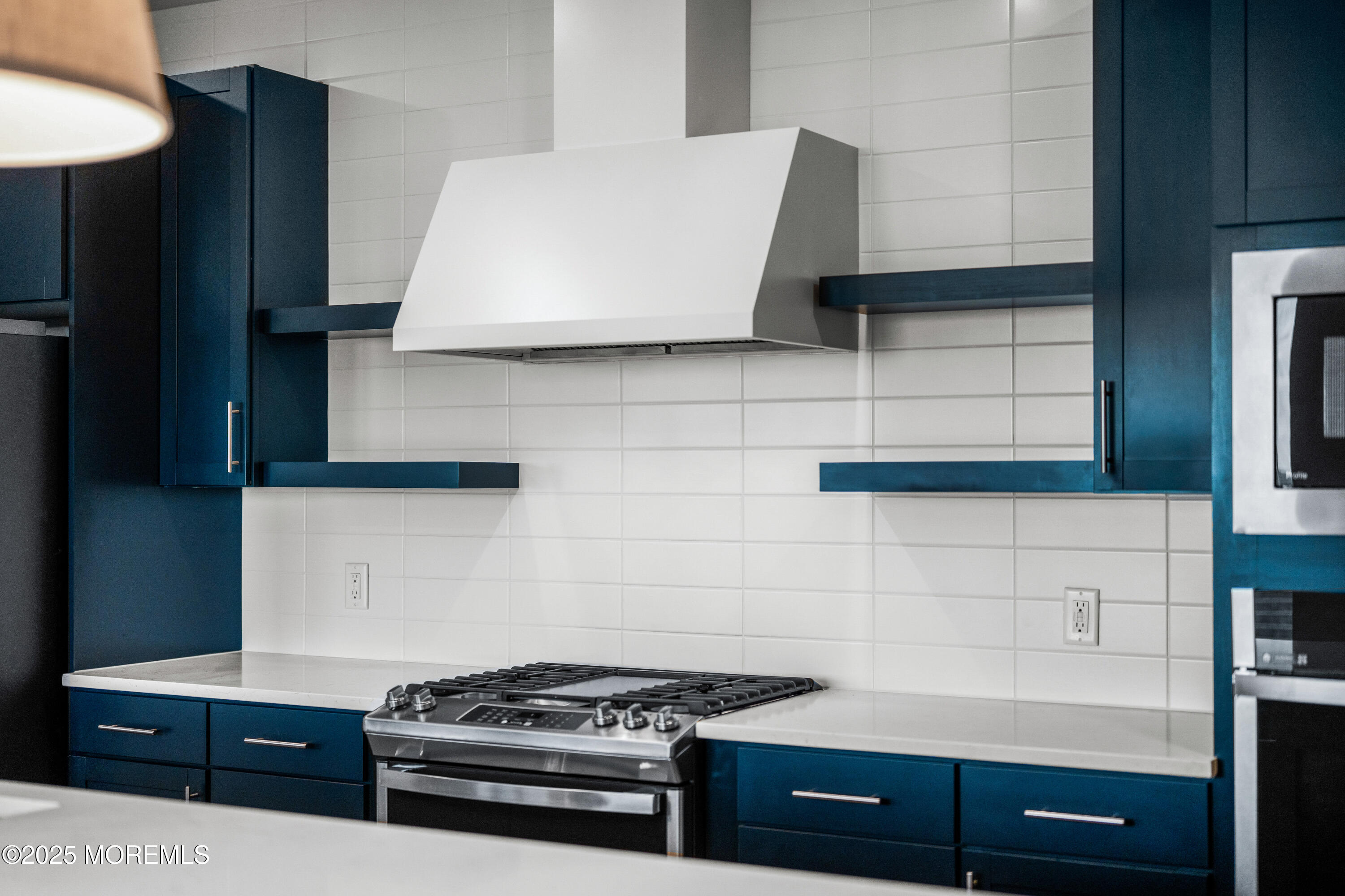 218 3rd Avenue, Unit 306 Asbury Park, NJ 07712 - Photo 18 of 66 a kitchen with granite countertop a stove and a sink