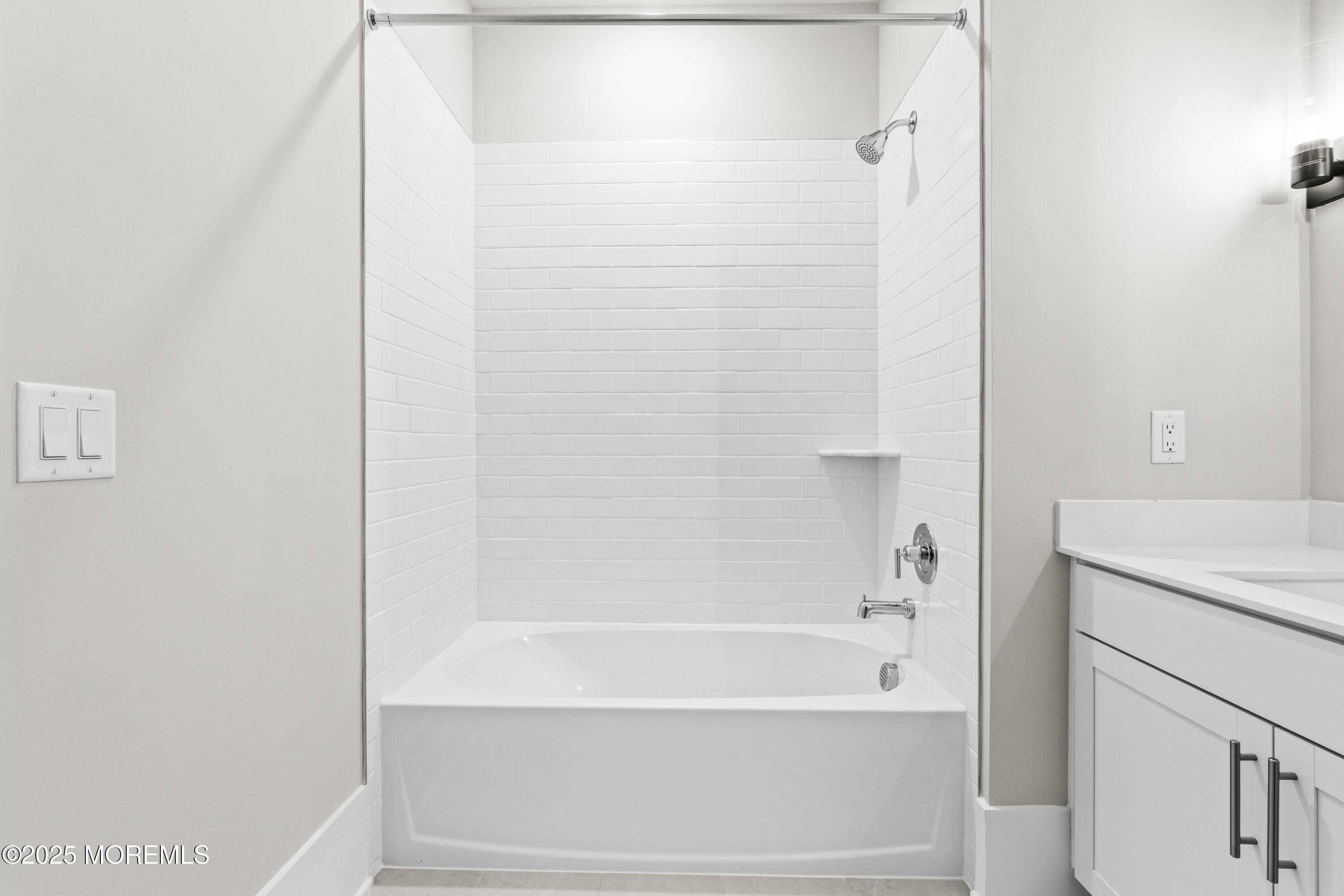 218 3rd Avenue, Unit 306 Asbury Park, NJ 07712 - Photo 33 of 66 a bathroom with a bathtub and a shower