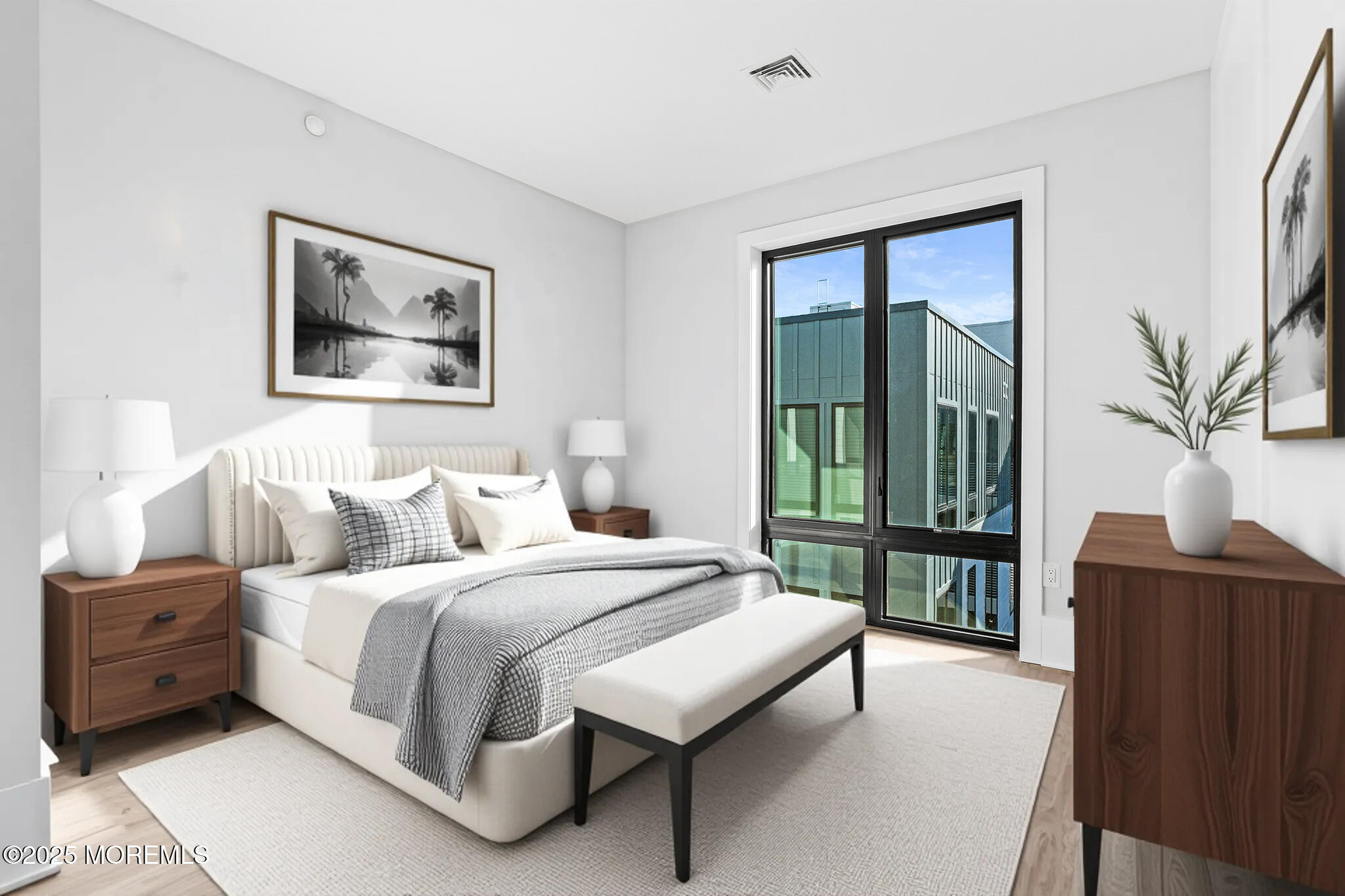 218 3rd Avenue, Unit 306 Asbury Park, NJ 07712 - Photo 37 of 66 a bedroom with a large bed and a window