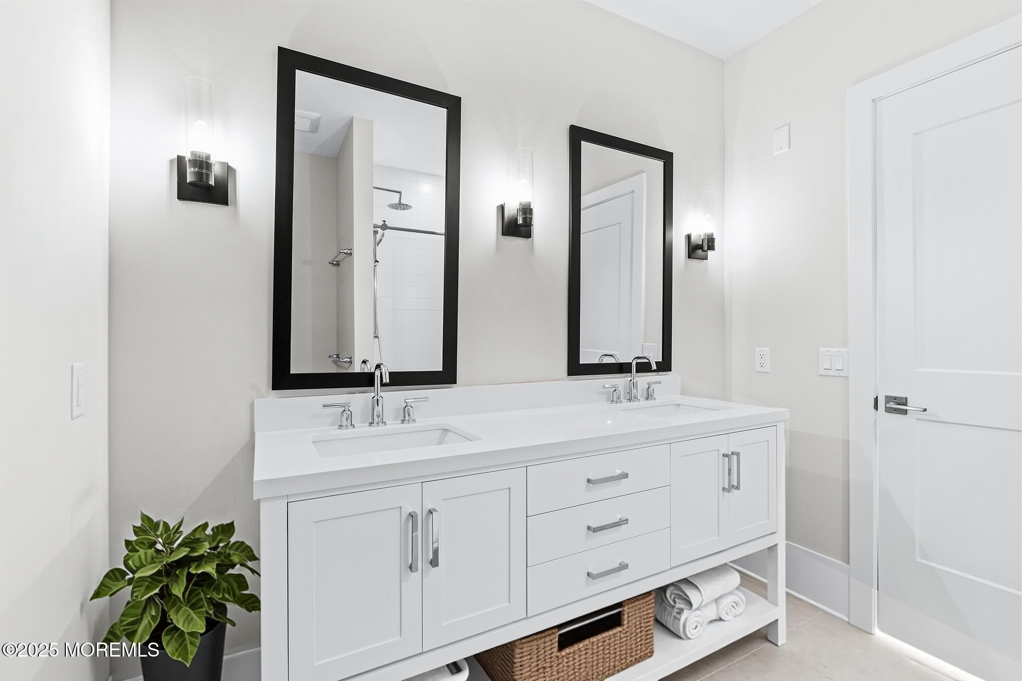 218 3rd Avenue, Unit 306 Asbury Park, NJ 07712 - Photo 41 of 66 a bathroom with a double vanity sink and mirror