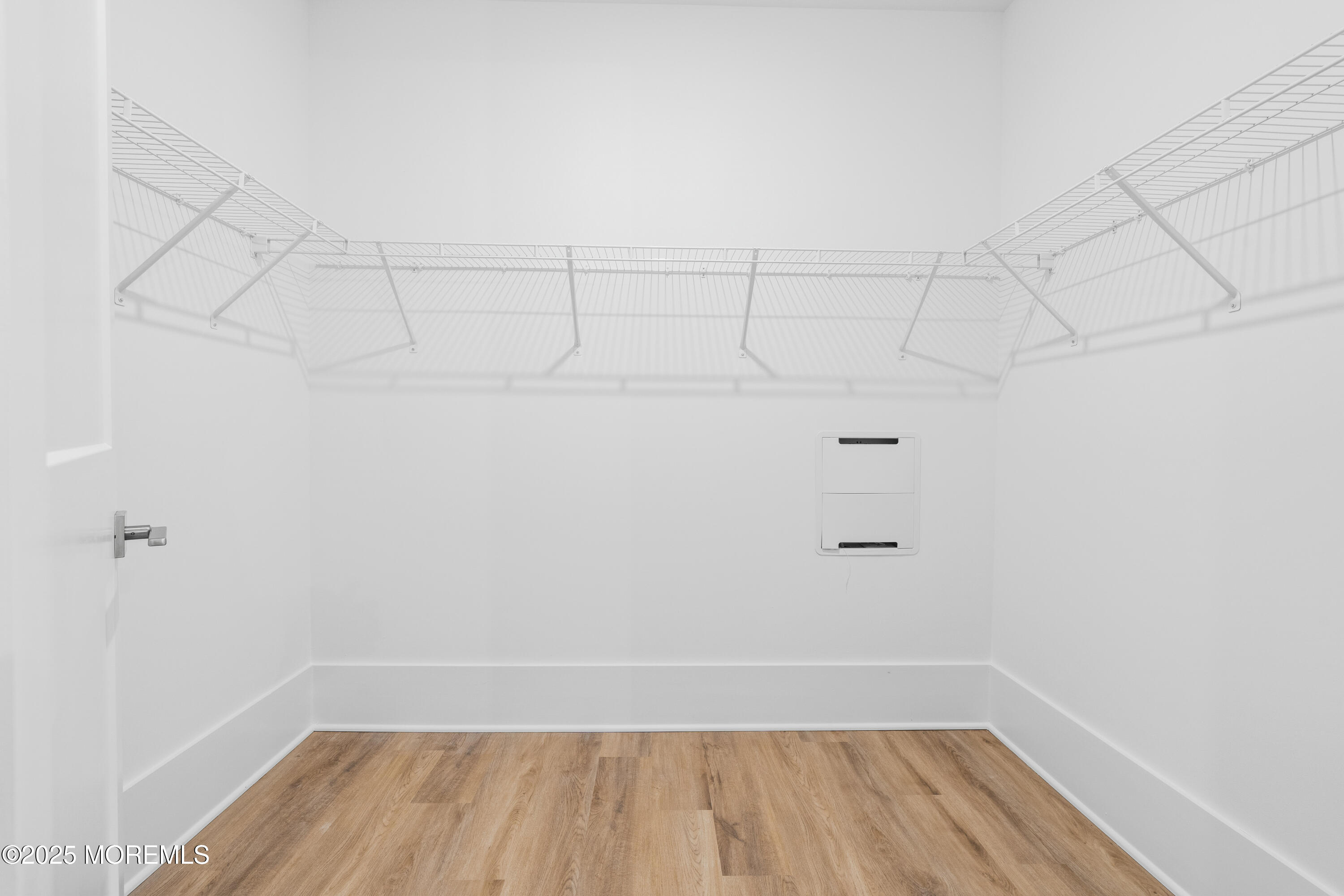 218 3rd Avenue, Unit 306 Asbury Park, NJ 07712 - Photo 45 of 66 a view of a room with racks on the wall