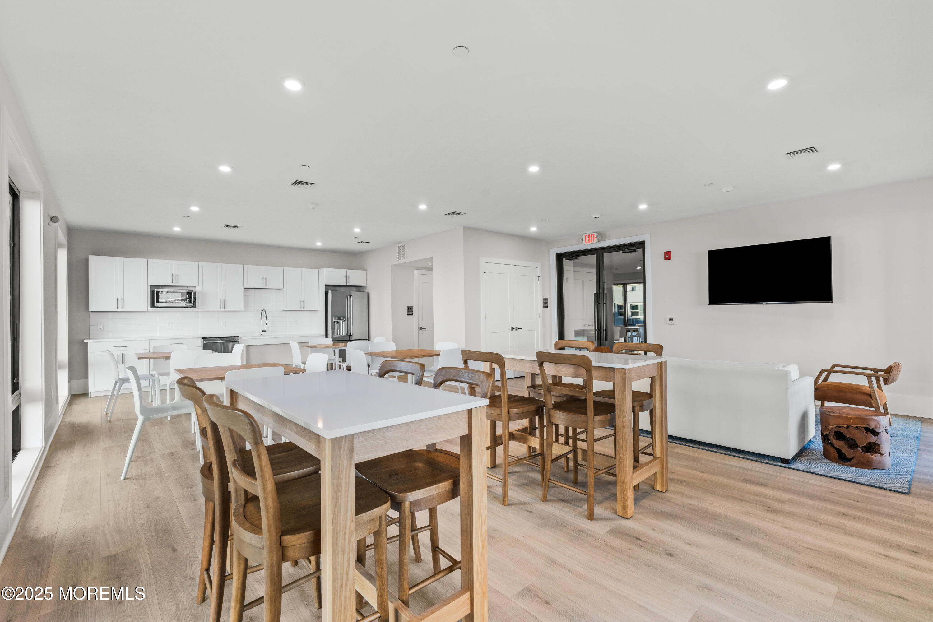 218 3rd Avenue, Unit 306 Asbury Park, NJ 07712 - Photo 47 of 66 a view of a dining room with furniture and wooden floor