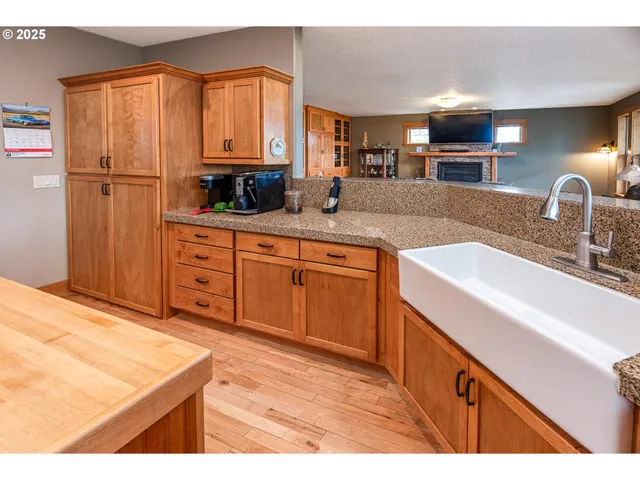 a kitchen with stainless steel appliances granite countertop a sink and a cabinets