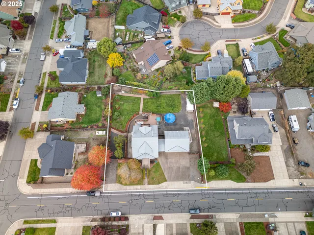 an aerial view of residential houses with outdoor space