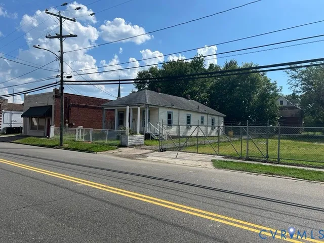 a view of a house in a big yard with a big tub