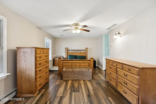 a view of hallway with furniture and chandelier